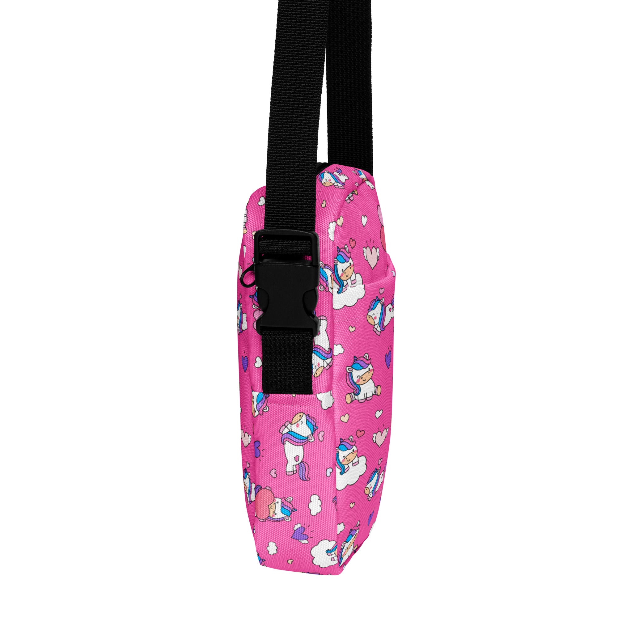 Girls pink unicorn crossbody purse made of fabric with black adjustable strap and buckle for easy carrying