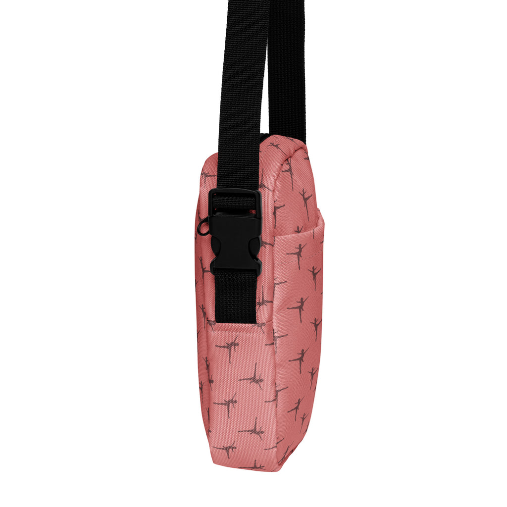 Pink girls ballet dancer crossbody purse with black ballet silhouettes on fabric and adjustable black strap