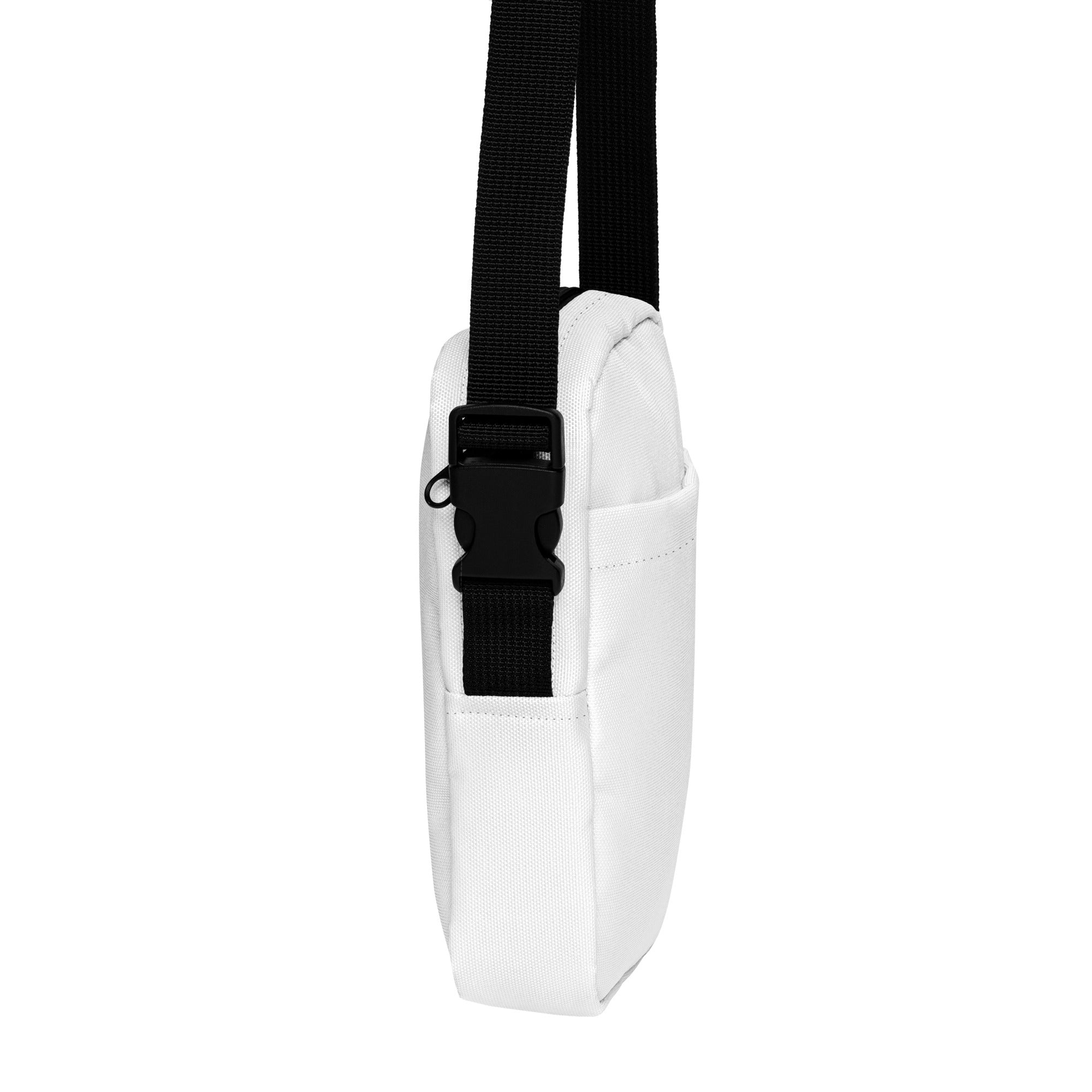 Girls white crossbody purse made of canvas with a black adjustable strap and buckle for easy carrying