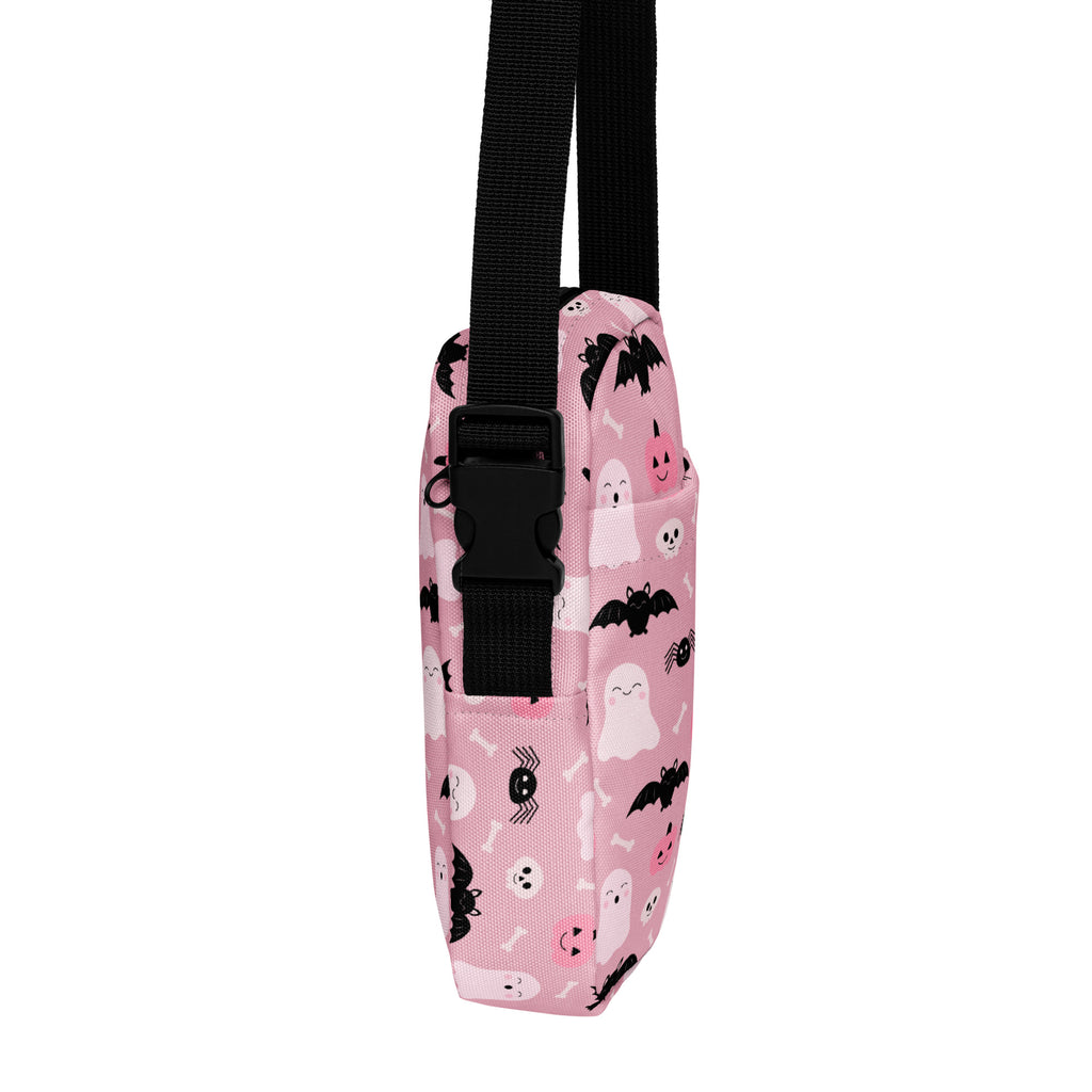 Girls cute ghost and bats pink halloween crossbody purse with black straps and buckle featuring spooky prints