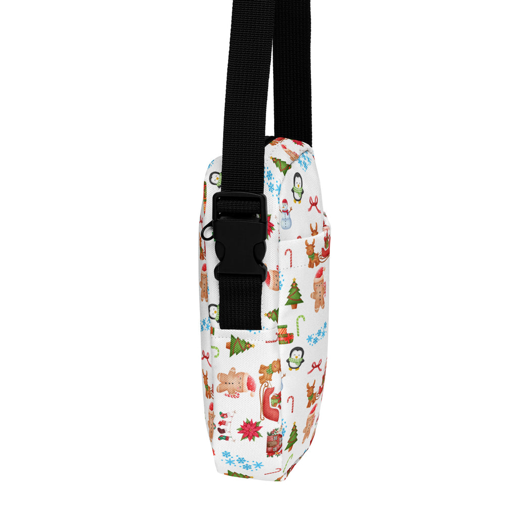 White fabric christmas women’s crossbody purse with black strap and festive gingerbread men and reindeer print