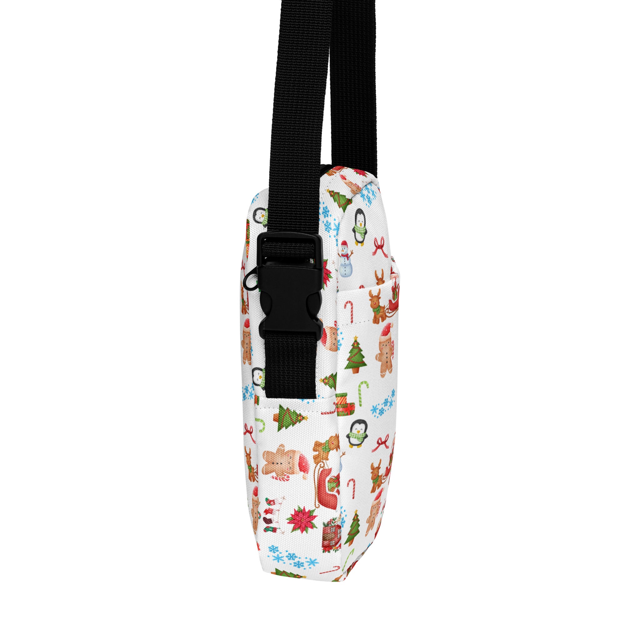 White fabric christmas women’s crossbody purse with black strap and festive gingerbread men and reindeer print