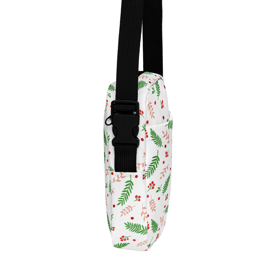 White winter fern and berry christmas women’s crossbody bag with festive green leaves red berries and black adjustable strap