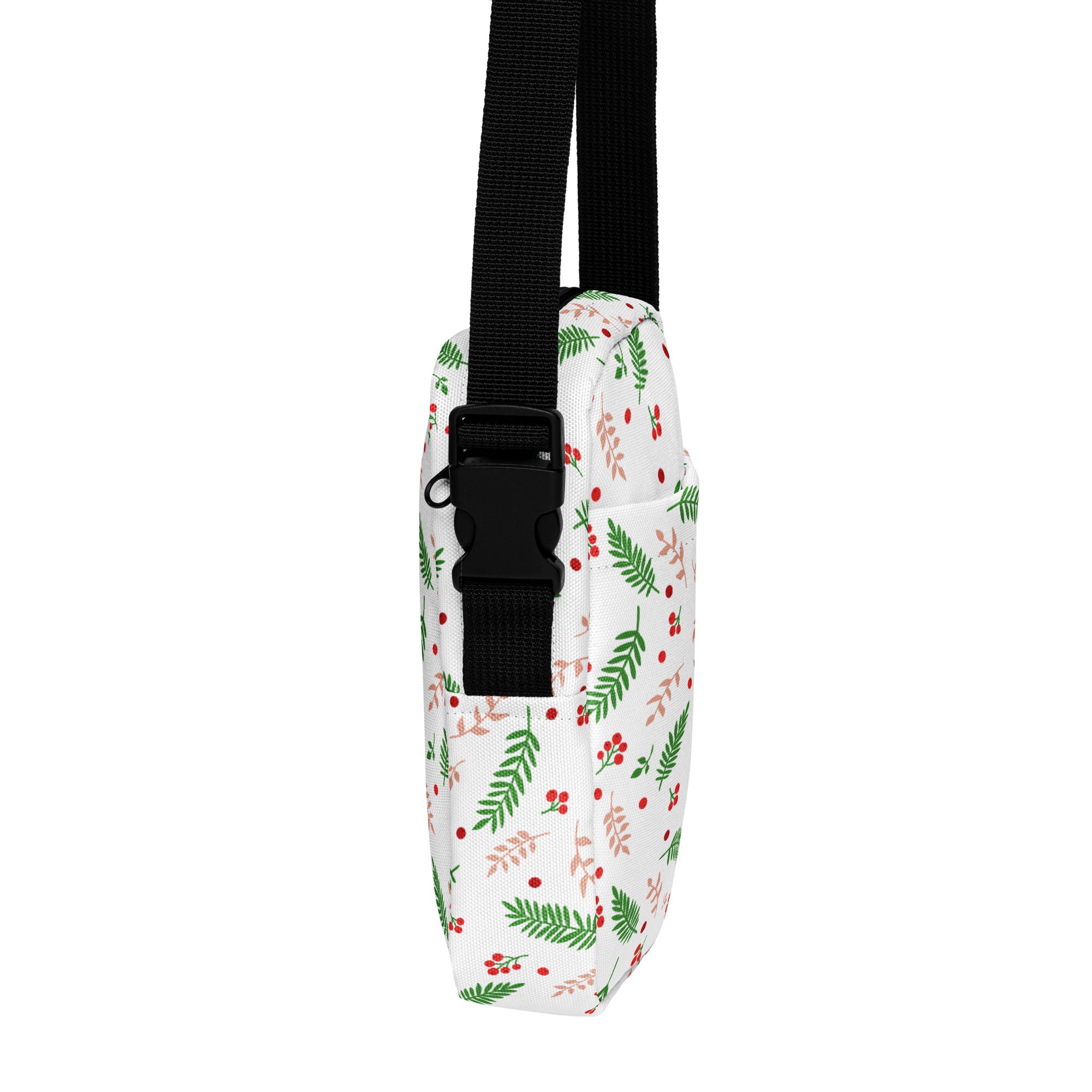 White winter fern and berry christmas women’s crossbody bag with festive green leaves red berries and black adjustable strap