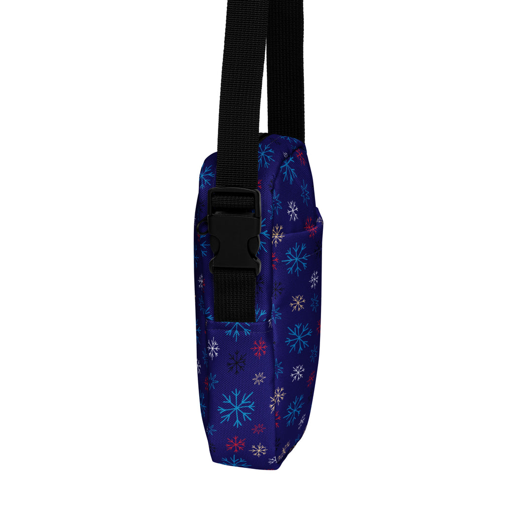Girls navy crossbody purse made of fabric with multicolor snowflake pattern in light blue white and pink