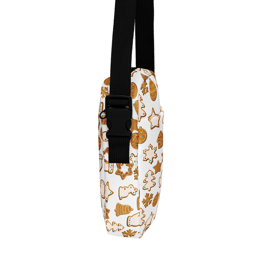White girls crossbody purse with festive gingerbread cookie pattern in golden brown and white and black adjustable strap