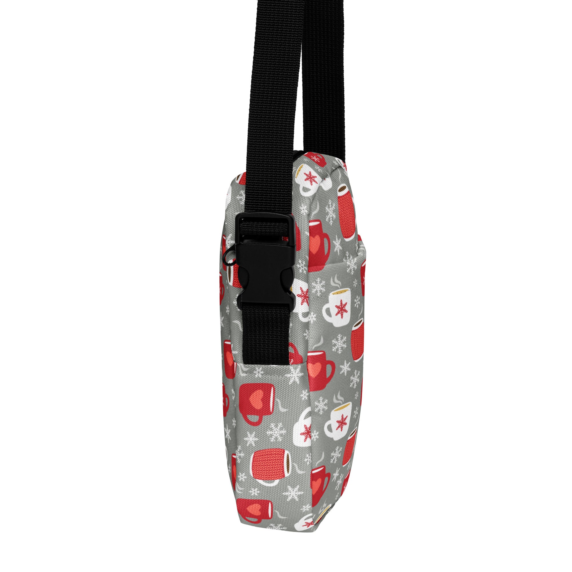 Gray crossbody bag with black adjustable strap featuring red and white coffee mug and snowflake patterns for winter use