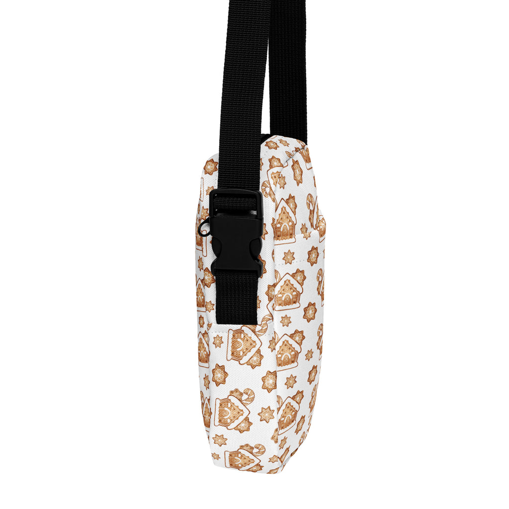 White girls gingerbread house christmas crossbody purse with festive brown star and house pattern and black adjustable strap