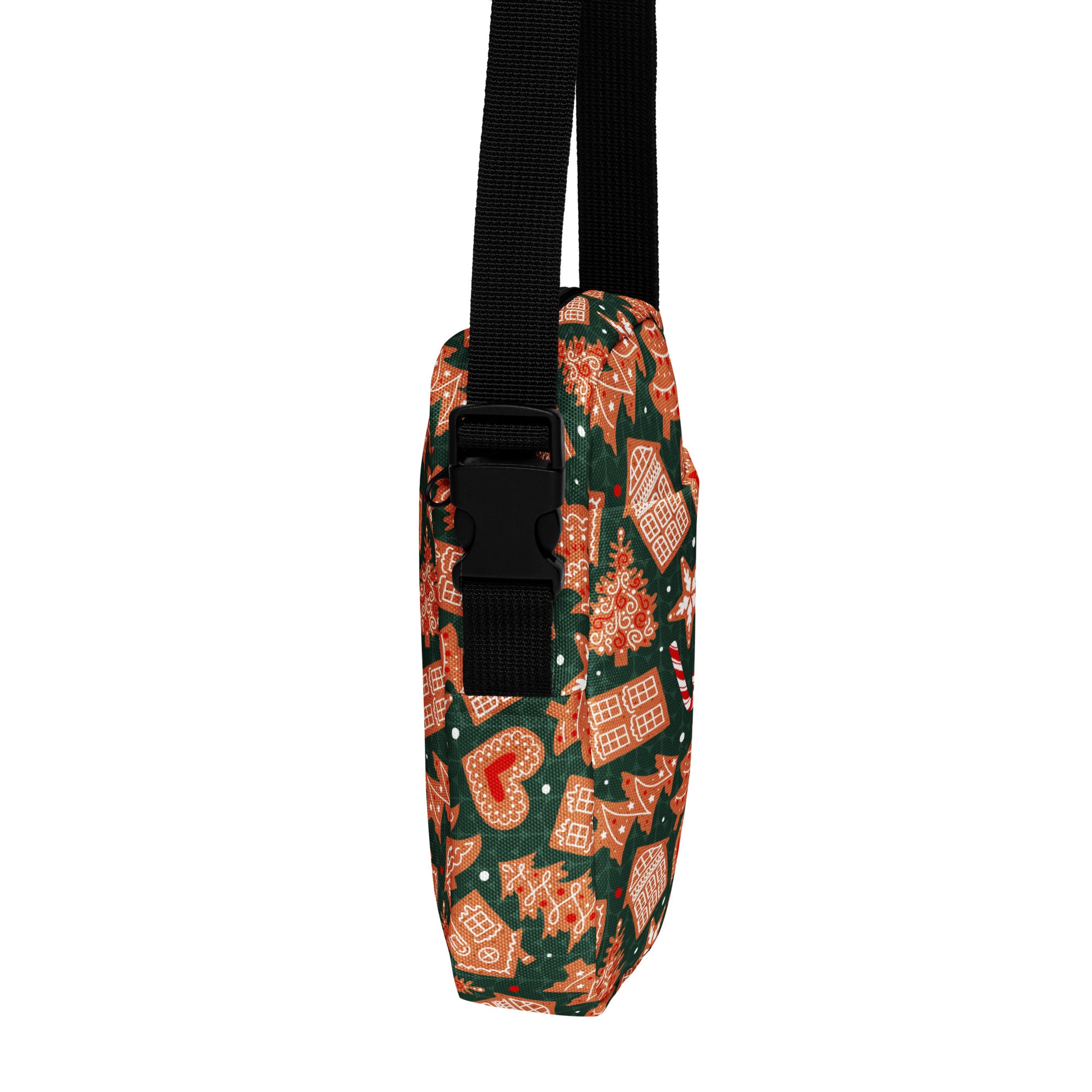 Green gingerbread Christmas women’s crossbody purse with festive green and orange gingerbread design and black adjustable strap