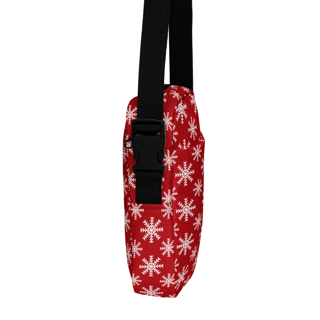 Red snowflake Christmas women’s crossbody purse with white pattern and black adjustable strap in fabric material