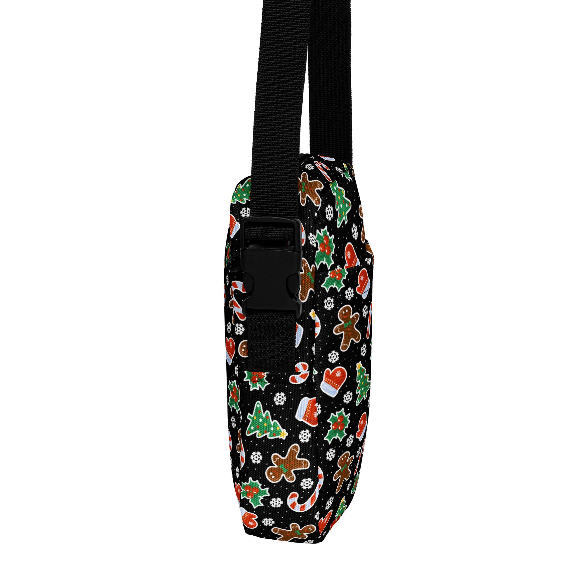 Black fabric girls crossbody bag with festive gingerbread candy cane and christmas tree patterns in red green and brown