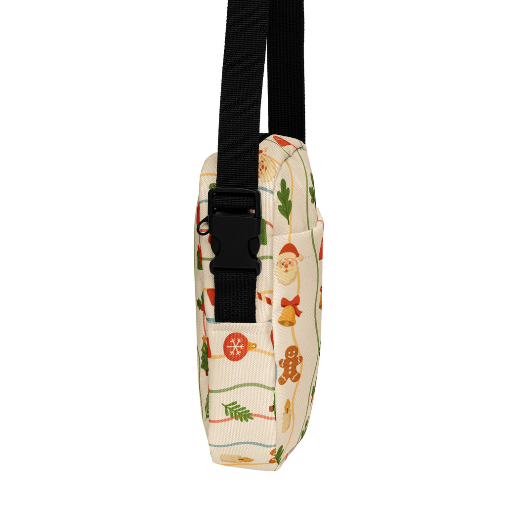 A festive cream-colored canvas girls christmas icons crossbody purse with santa gingerbread men and ornaments pattern
