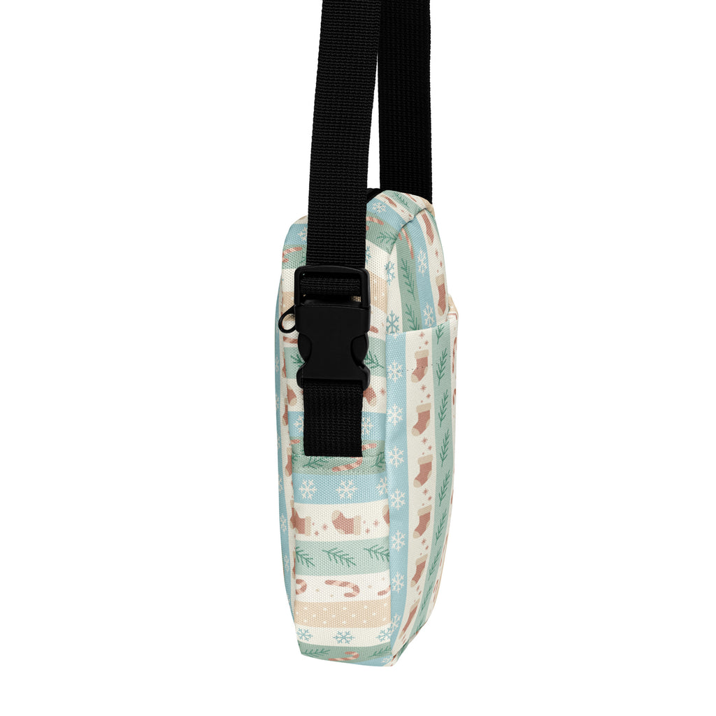 Pastel Christmas stripes women’s crossbody purse in light blue and cream with festive patterns and black adjustable strap