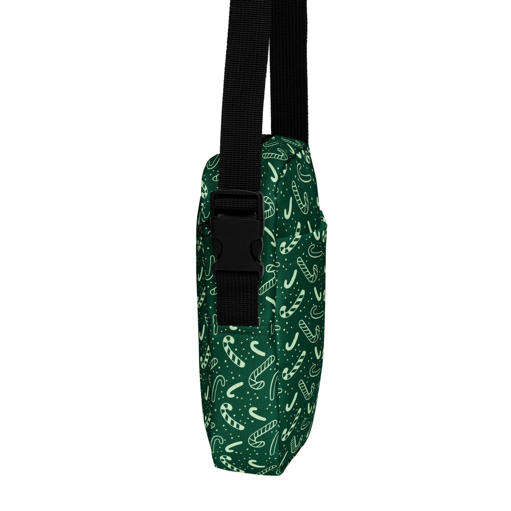 Girls green candy cane christmas crossbody purse made of dark green fabric with white candy cane and star patterns