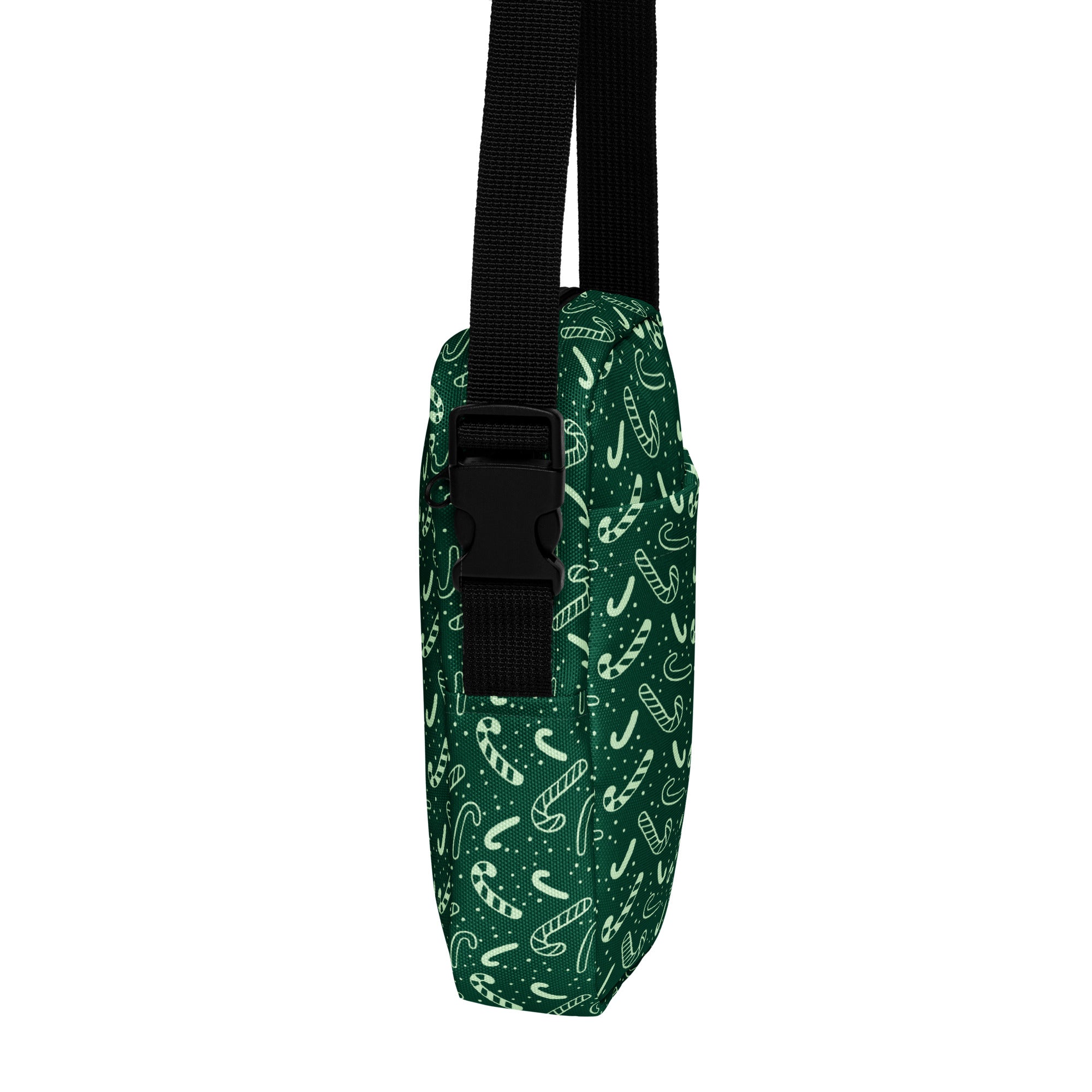 Girls green candy cane christmas crossbody purse made of dark green fabric with white candy cane and star patterns