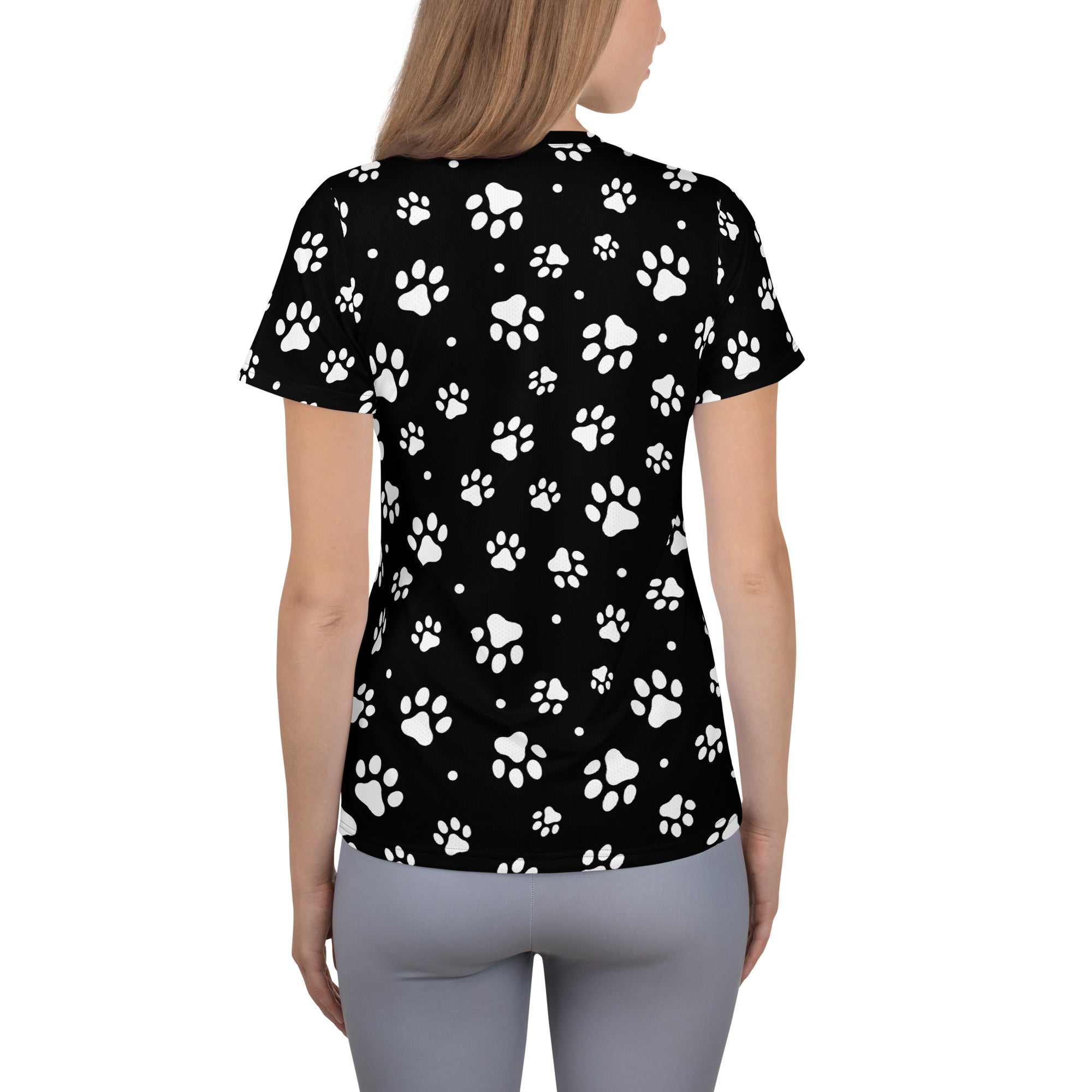 Black women’s paw print performance athletic t-shirt with white prints, lightweight moisture wicking fabric, upf 50 plus protection