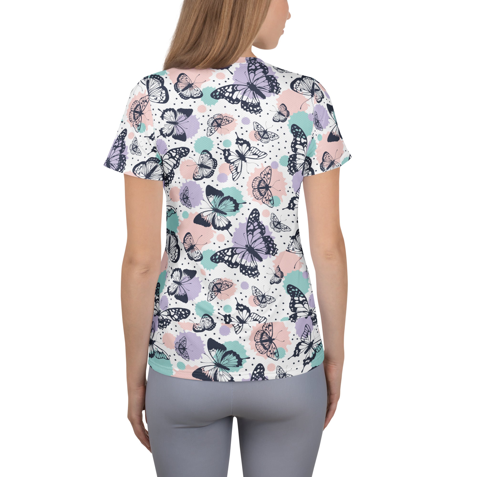 Women’s white short-sleeved butterfly print performance t-shirt with moisture wicking fabric and UPF 50+ for workouts