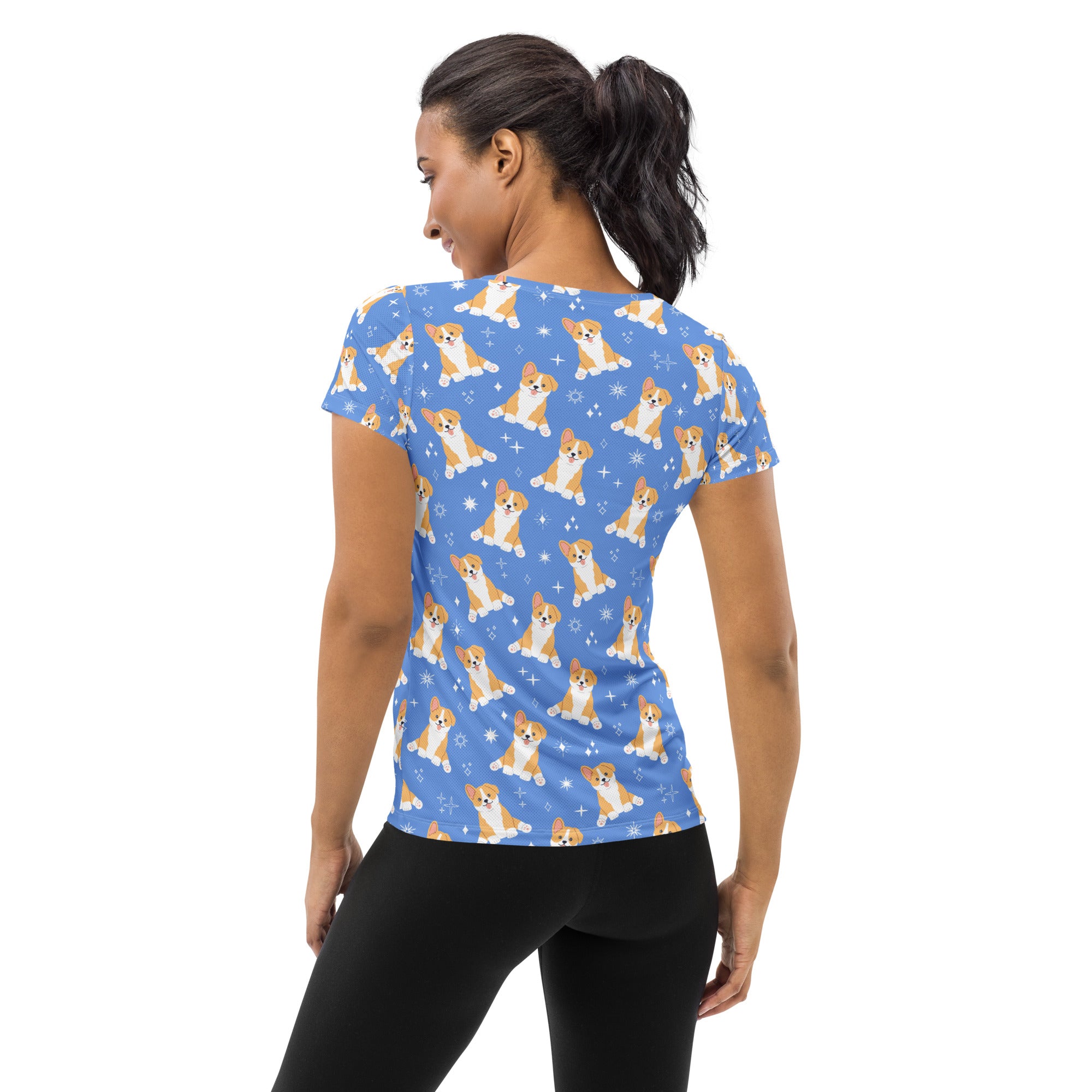 Women’s blue short-sleeved corgi dog performance athletic t-shirt with playful puppy pattern and moisture wicking fabric