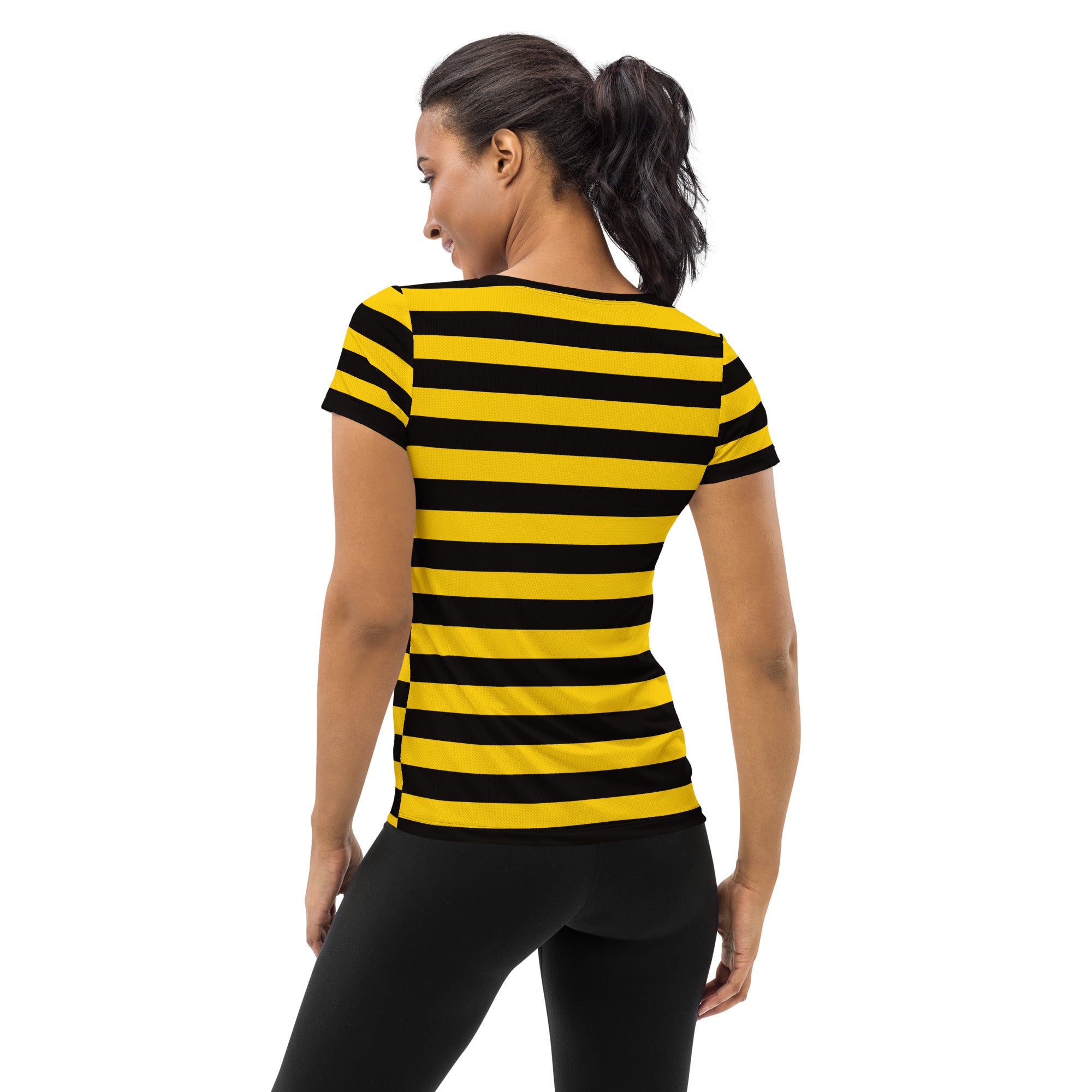 A woman wearing a lightweight moisture wicking women’s bumblebee stripe performance athletic t-shirt with upf 50+
