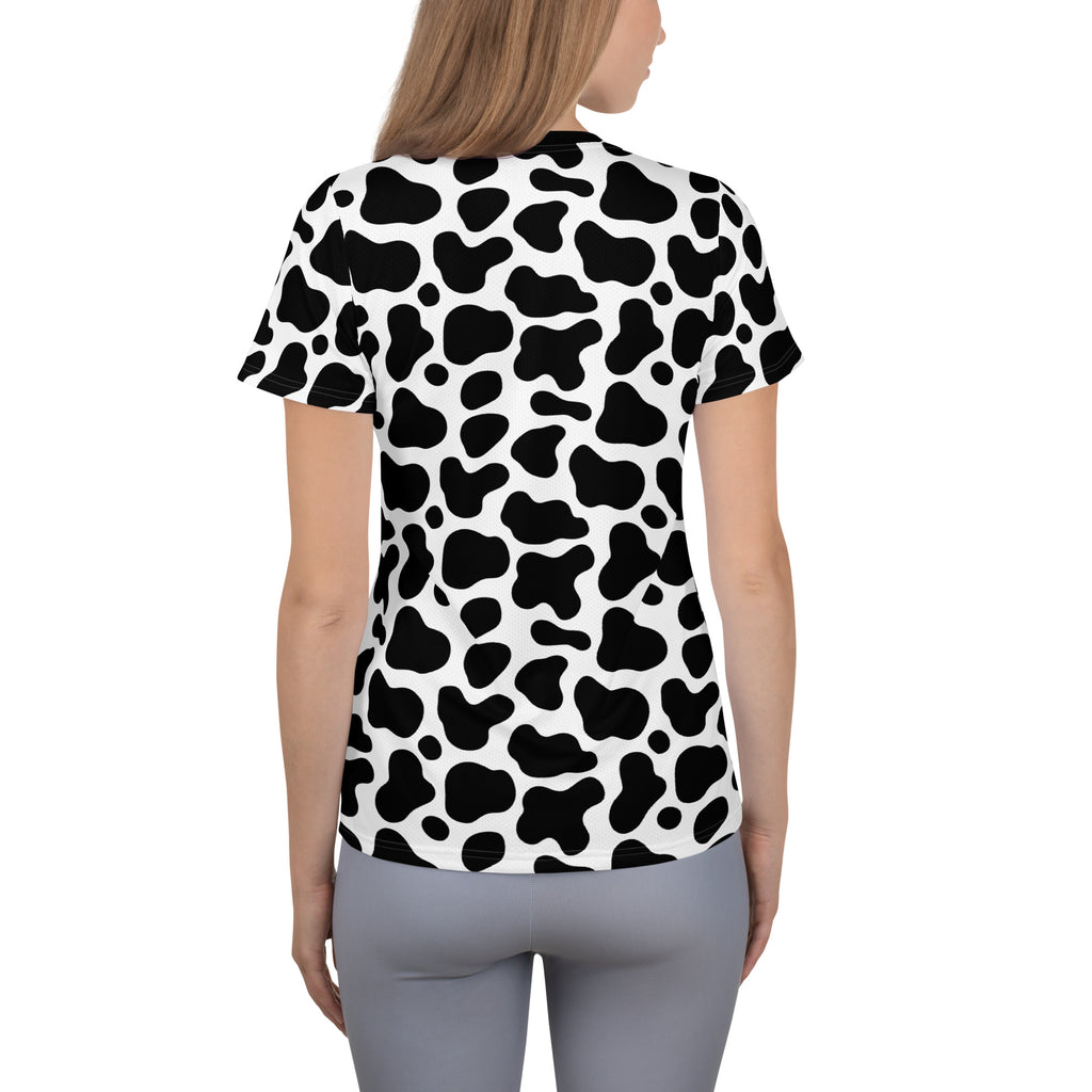 Women’s black and white cow print short-sleeved performance t-shirt with lightweight moisture wicking fabric
