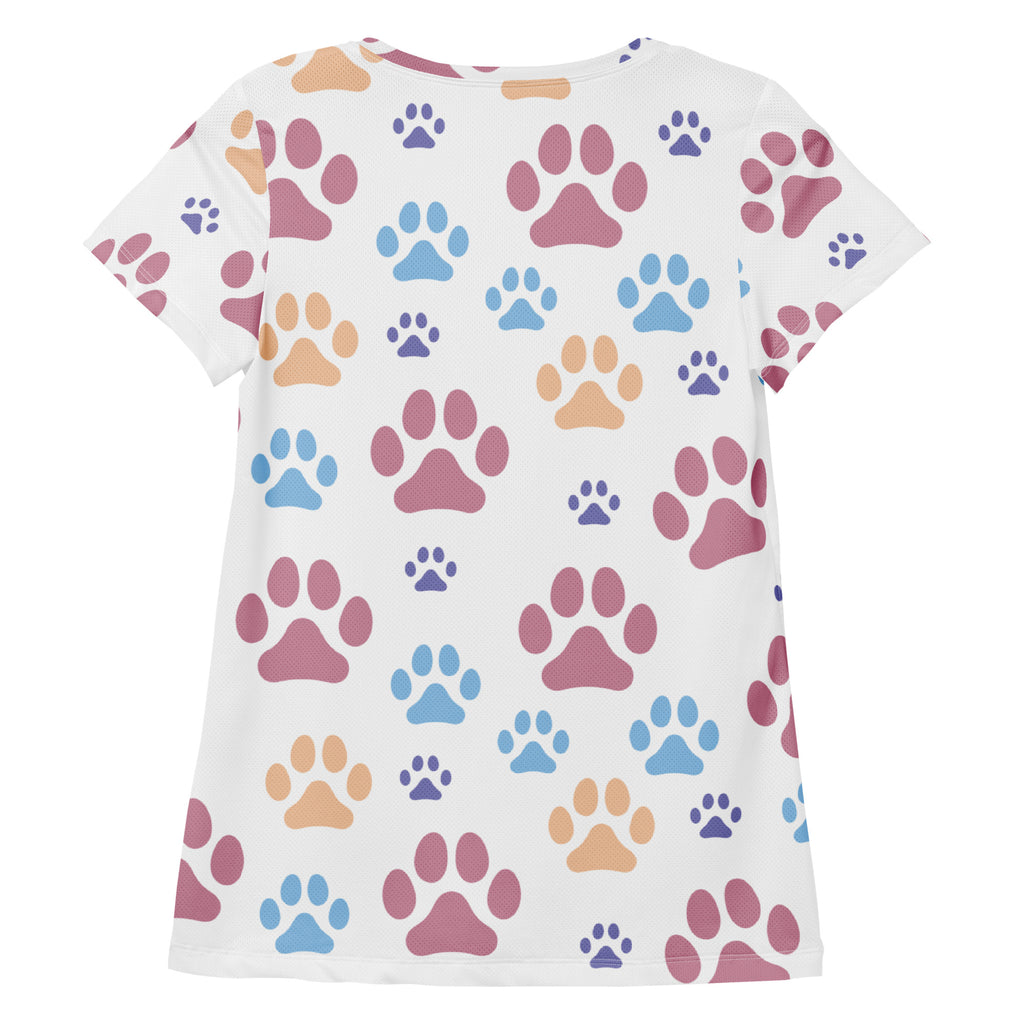 White women’s short-sleeved performance t-shirt with colorful paw print design, lightweight moisture wicking fabric, UPF 50+