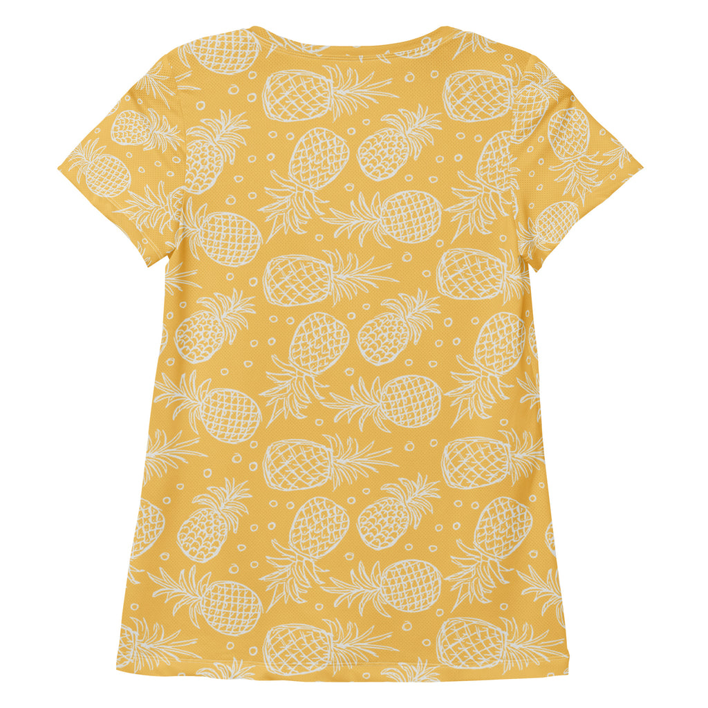 Women’s yellow short-sleeved performance athletic t-shirt with white pineapple pattern and moisture wicking fabric