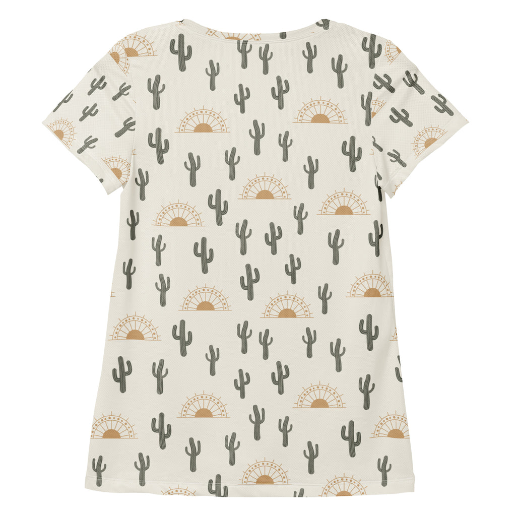 Cream-colored women’s desert cactus sunrise performance t-shirt with gray cactus and tan sunset pattern, lightweight and moisture wicking