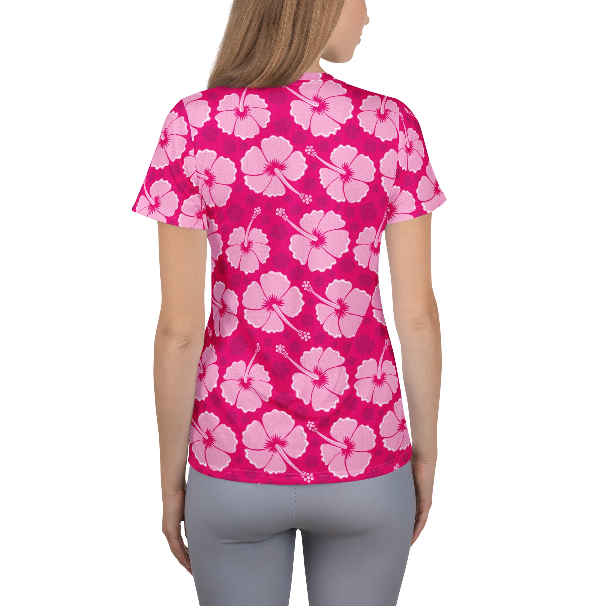 Vibrant pink women’s hibiscus short-sleeved performance t-shirt with moisture wicking fabric and upf 50 plus protection
