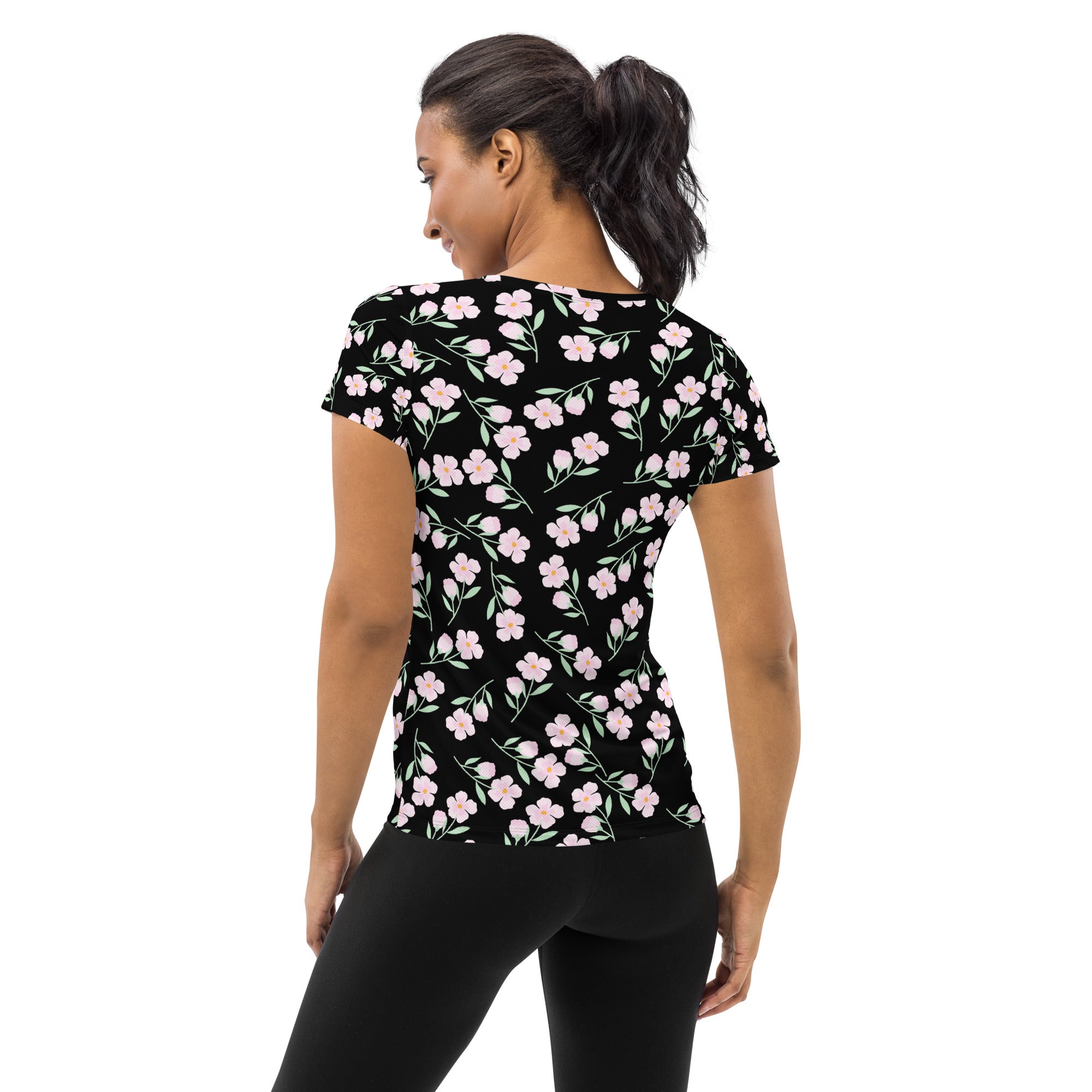 Women’s black short-sleeved floral performance athletic t-shirt with lightweight moisture wicking fabric and UPF 50+