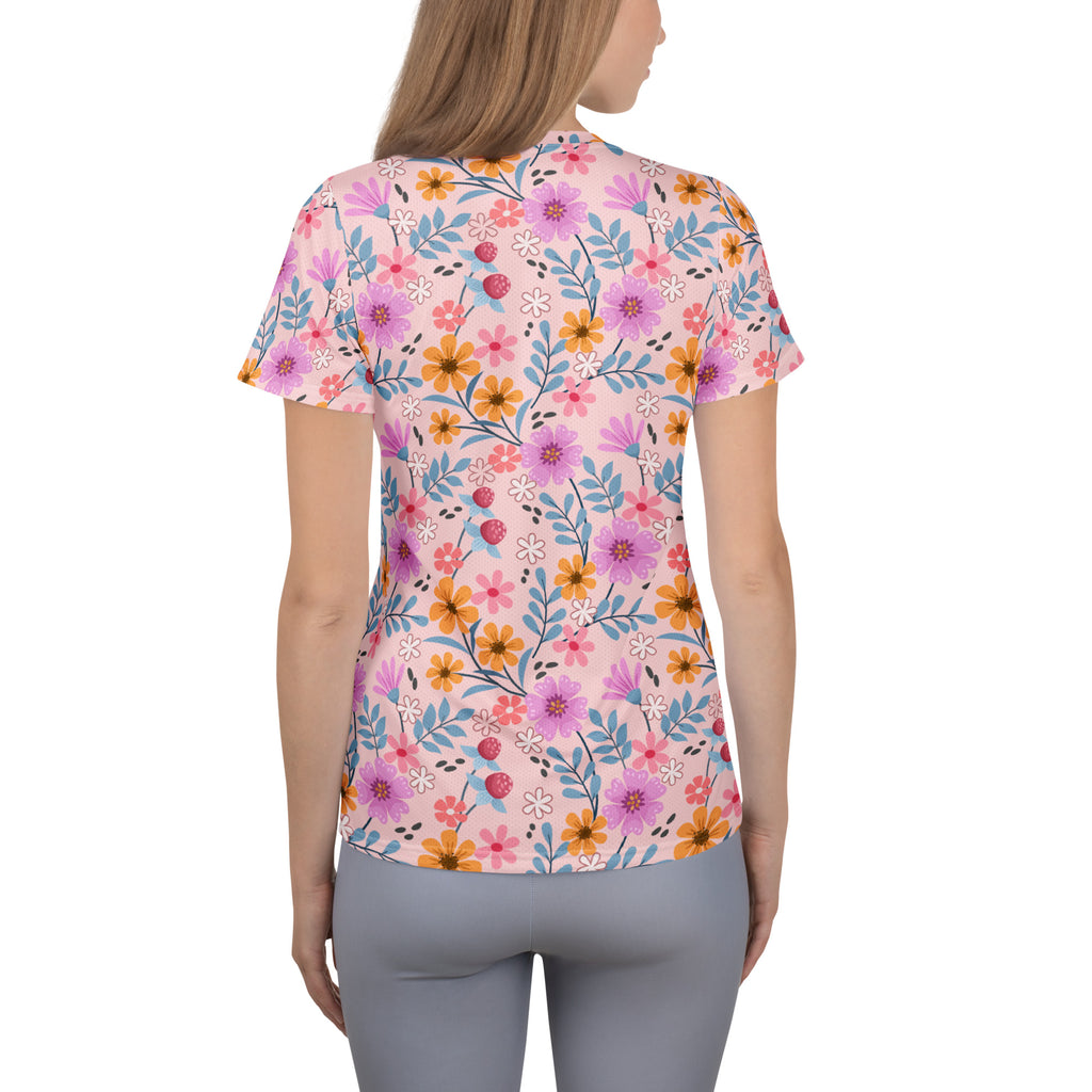 Women’s pink short-sleeved floral performance athletic t-shirt with lightweight moisture wicking fabric and upf 50+ protection