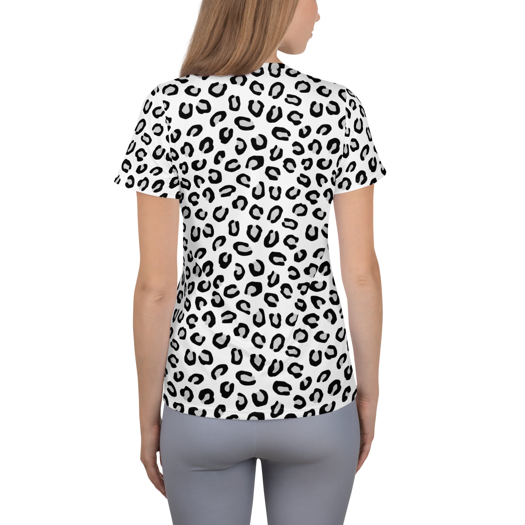 White short-sleeved women’s athletic t-shirt with bold black leopard print lightweight moisture wicking upf 50+