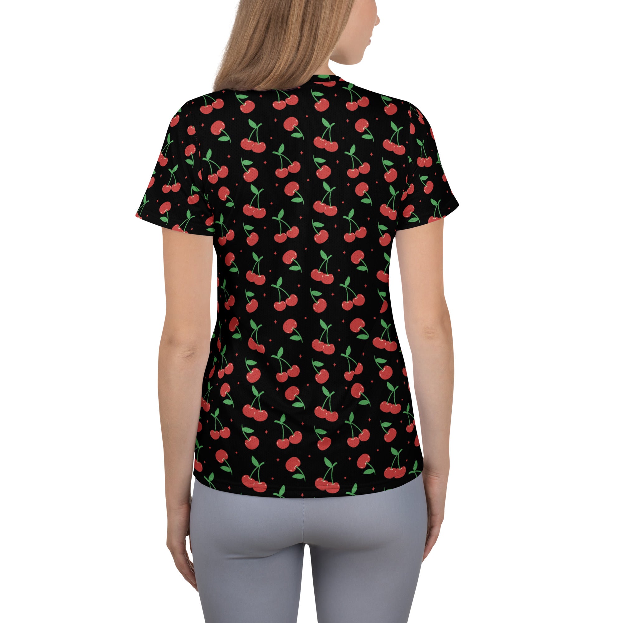 Women’s black short-sleeved cherry print performance athletic t-shirt with moisture wicking and upf 50+ protection