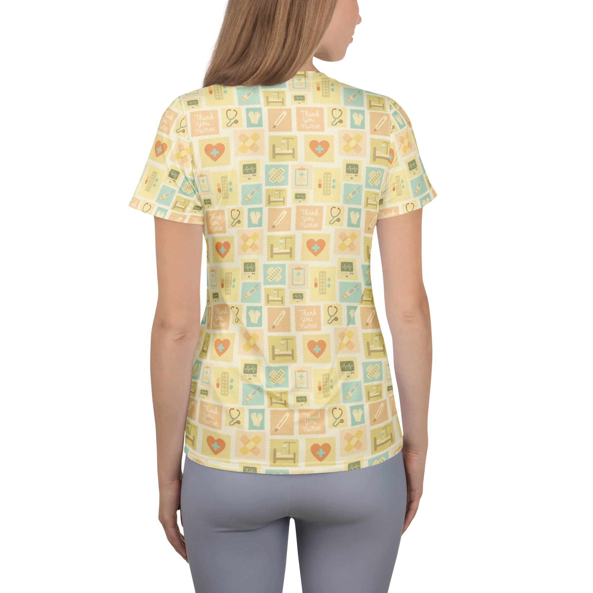 Women’s yellow short-sleeved scrub top with medical icon pattern lightweight moisture wicking with upf 50+ protection
