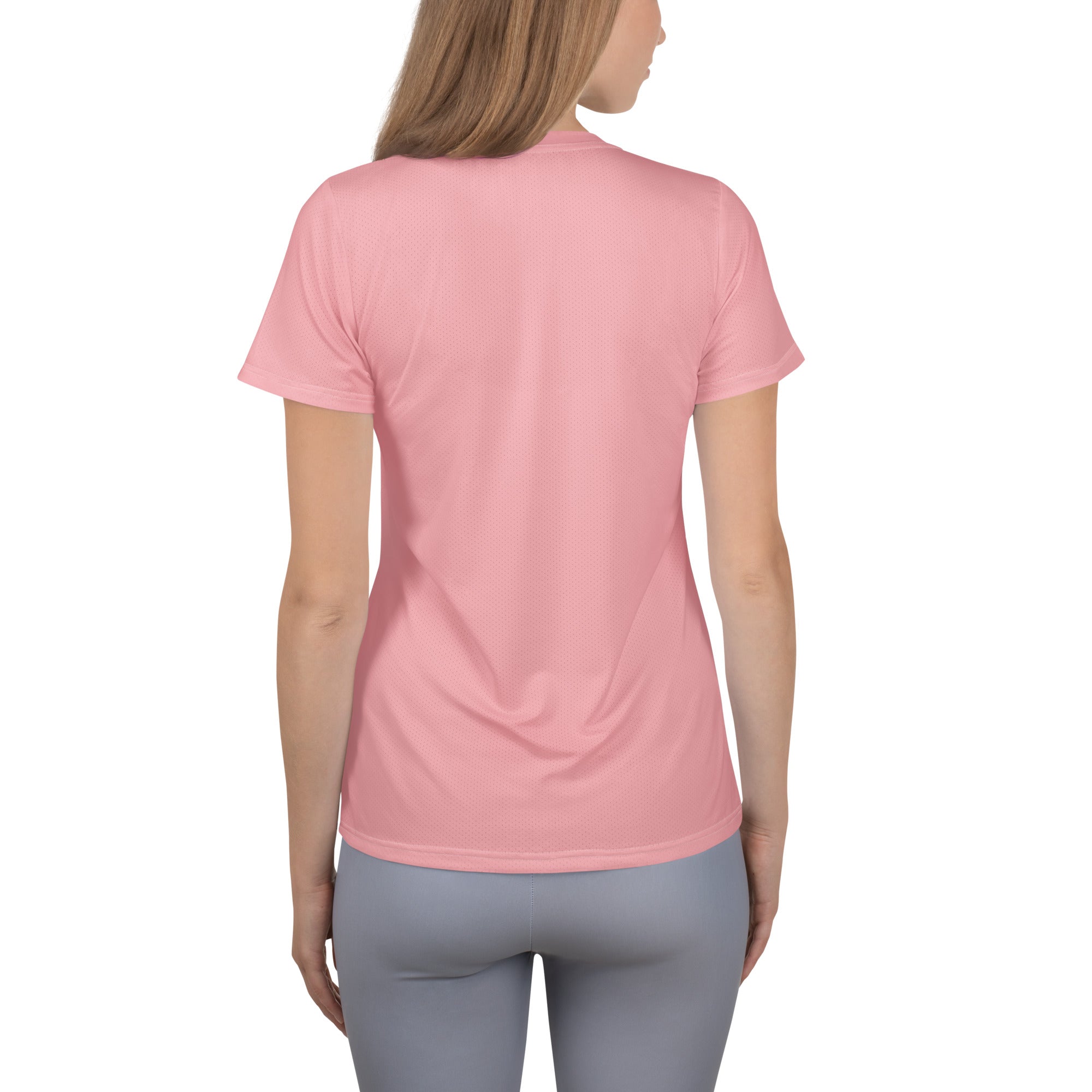 A soft pink women’s short-sleeved crew neck performance athletic t-shirt with lightweight moisture wicking fabric and UPF 50+