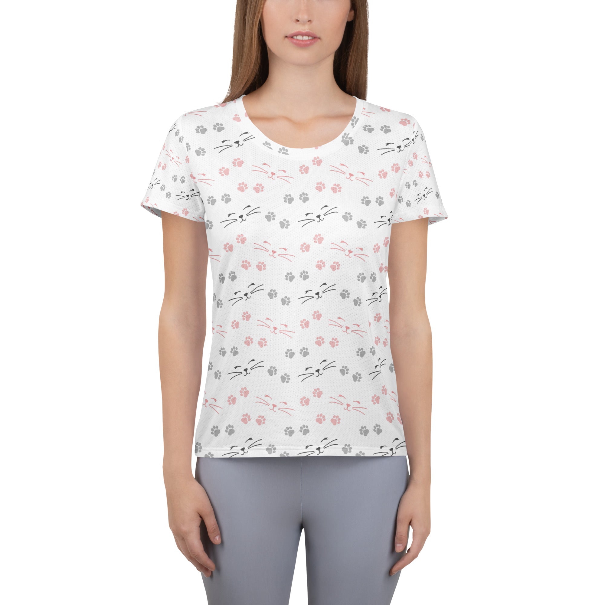 White women’s short-sleeved performance t-shirt with pink and gray cat faces and paw prints for athletic use