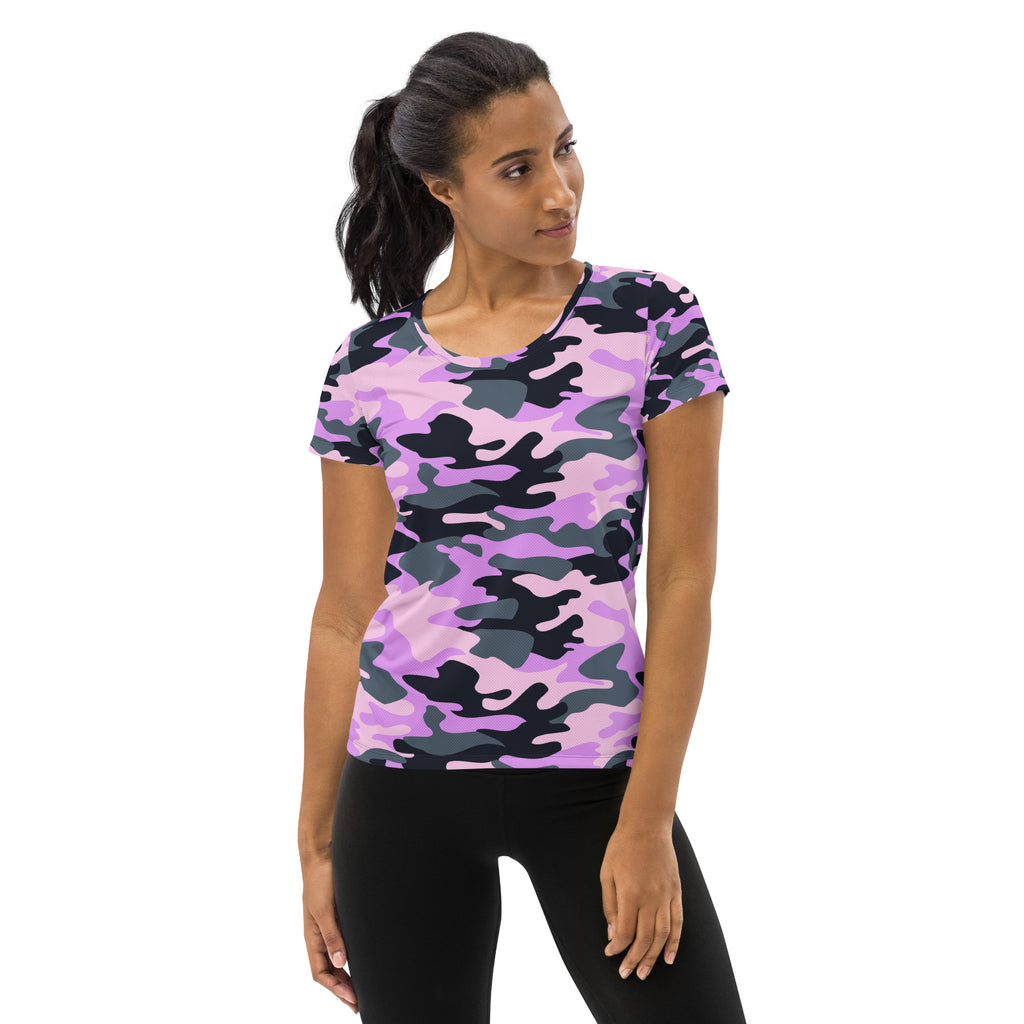 A woman wears a lightweight moisture wicking women’s purple camouflage short sleeve athletic t-shirt with upf 50+
