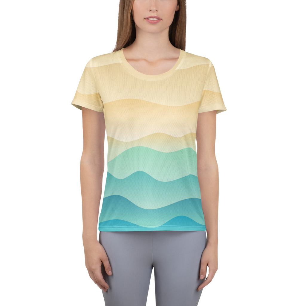 Women’s short-sleeved performance athletic t-shirt with soft yellow and teal gradient wavy stripes and UPF 50+ protection