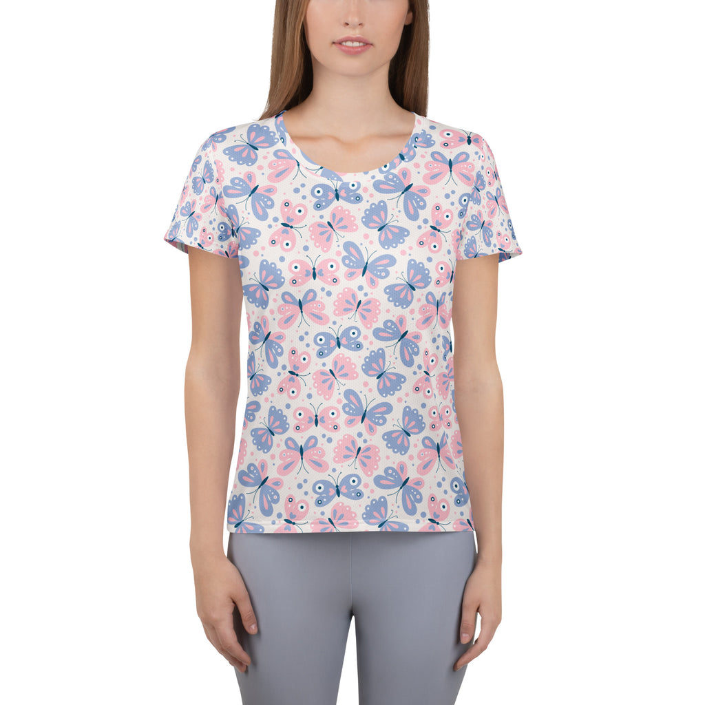 A soft white short-sleeved performance athletic t-shirt with pink and blue cartoon butterflies and UPF 50+ protection