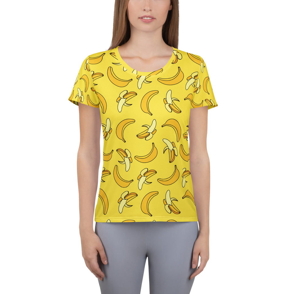 Bright yellow banana-print women’s short-sleeve performance t-shirt with scoop neckline and moisture wicking fabric