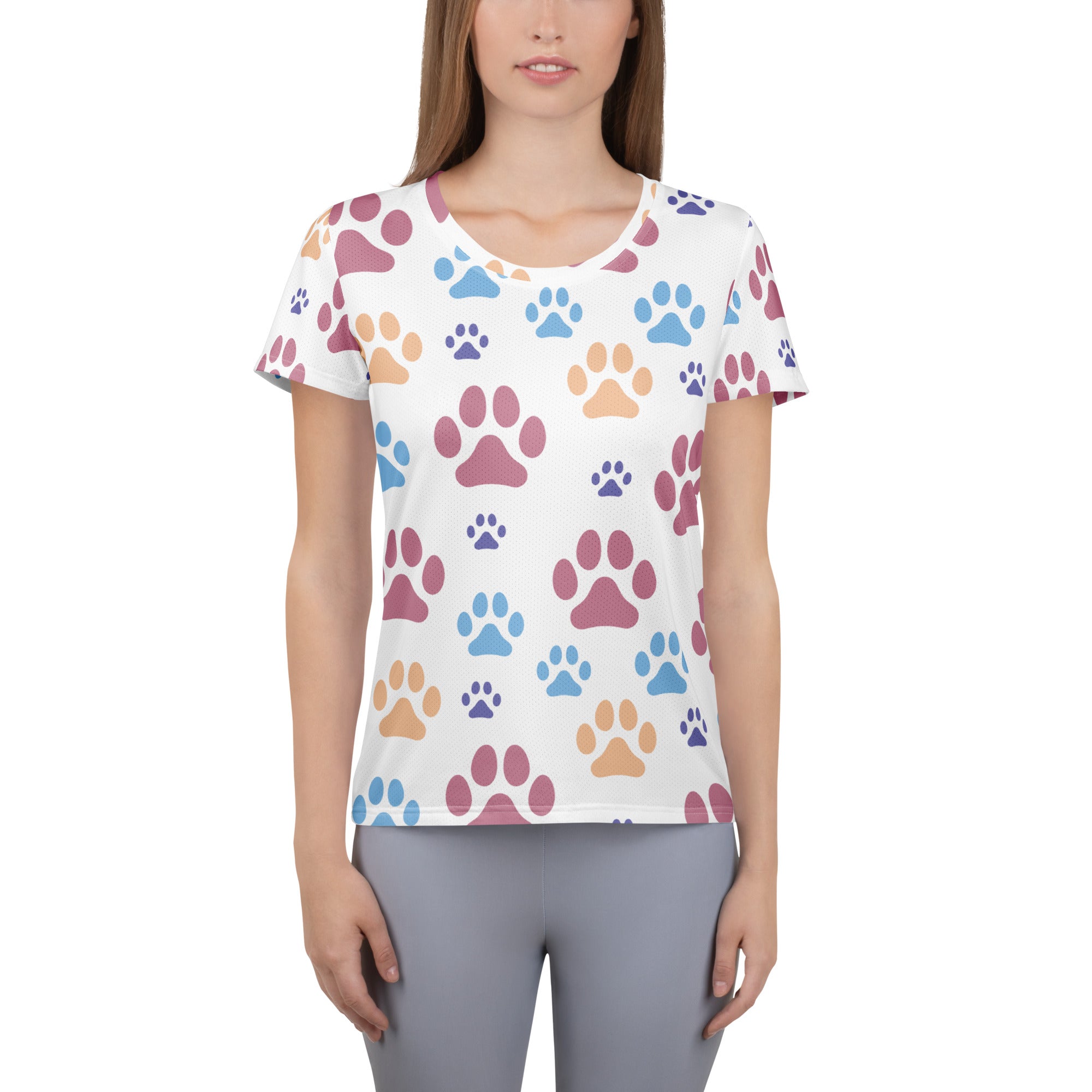 White women’s short-sleeved performance t-shirt with colorful pink blue and orange paw prints lightweight moisture wicking with UPF 50+