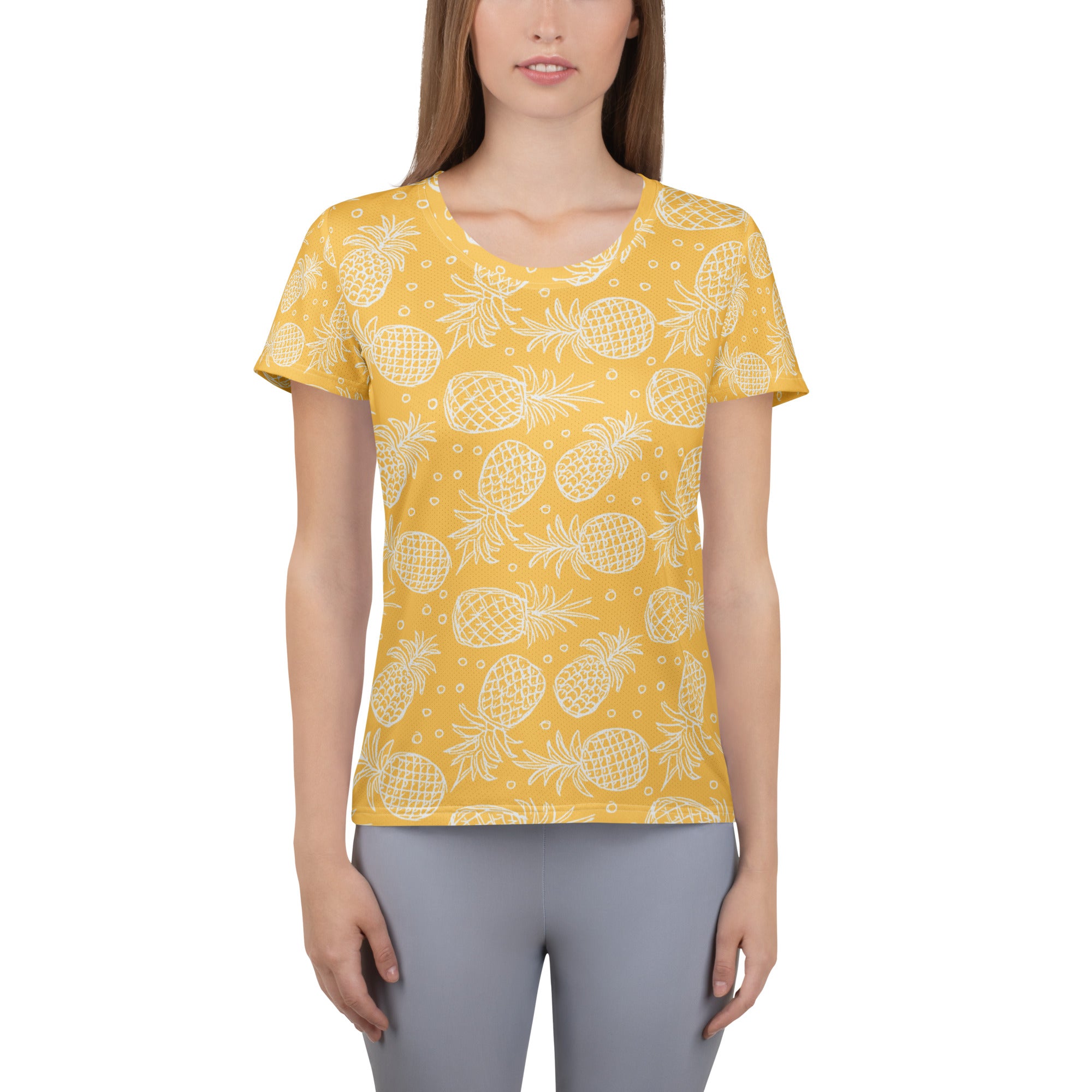 Women’s yellow short-sleeved performance athletic t-shirt with white pineapple print, lightweight moisture wicking fabric, UPF 50+