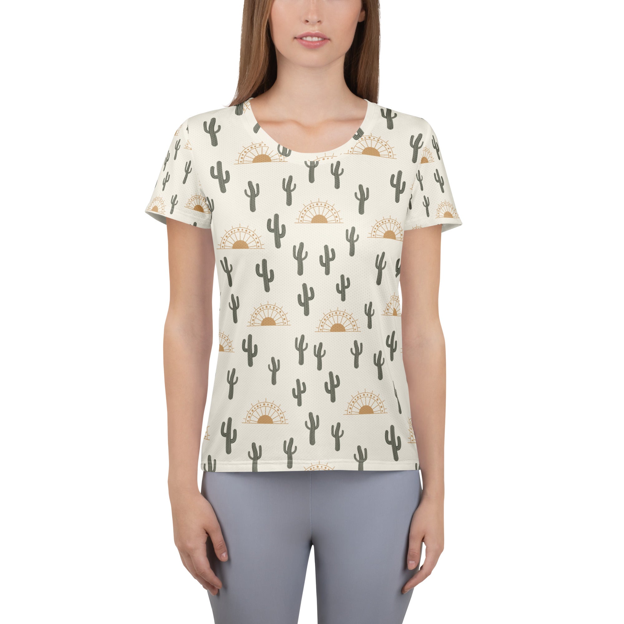 Cream-colored women’s performance athletic t-shirt with black cactus and gold sunburst pattern, lightweight and moisture wicking
