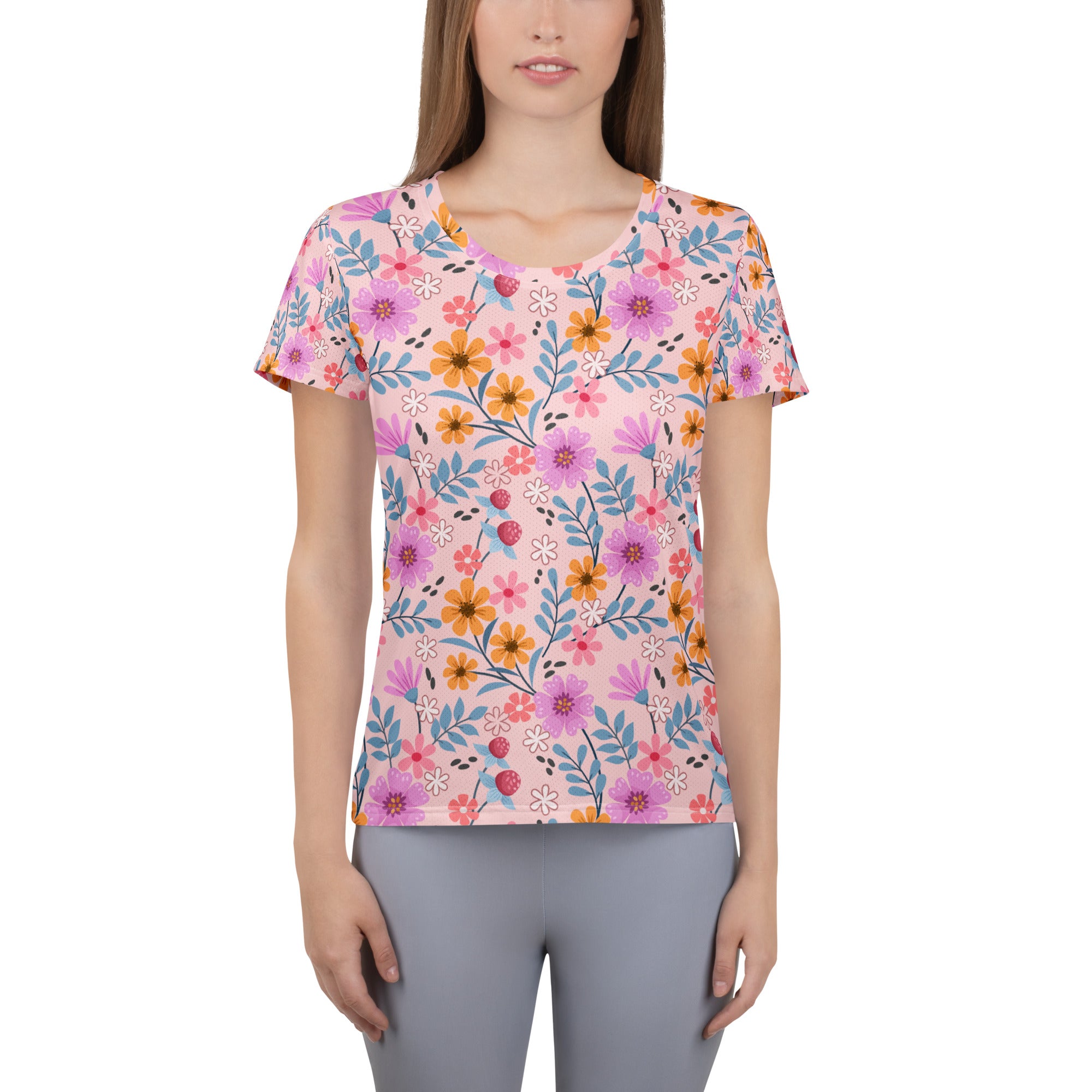 Women’s pink short-sleeved floral performance athletic t-shirt with moisture wicking fabric and UPF 50+ protection
