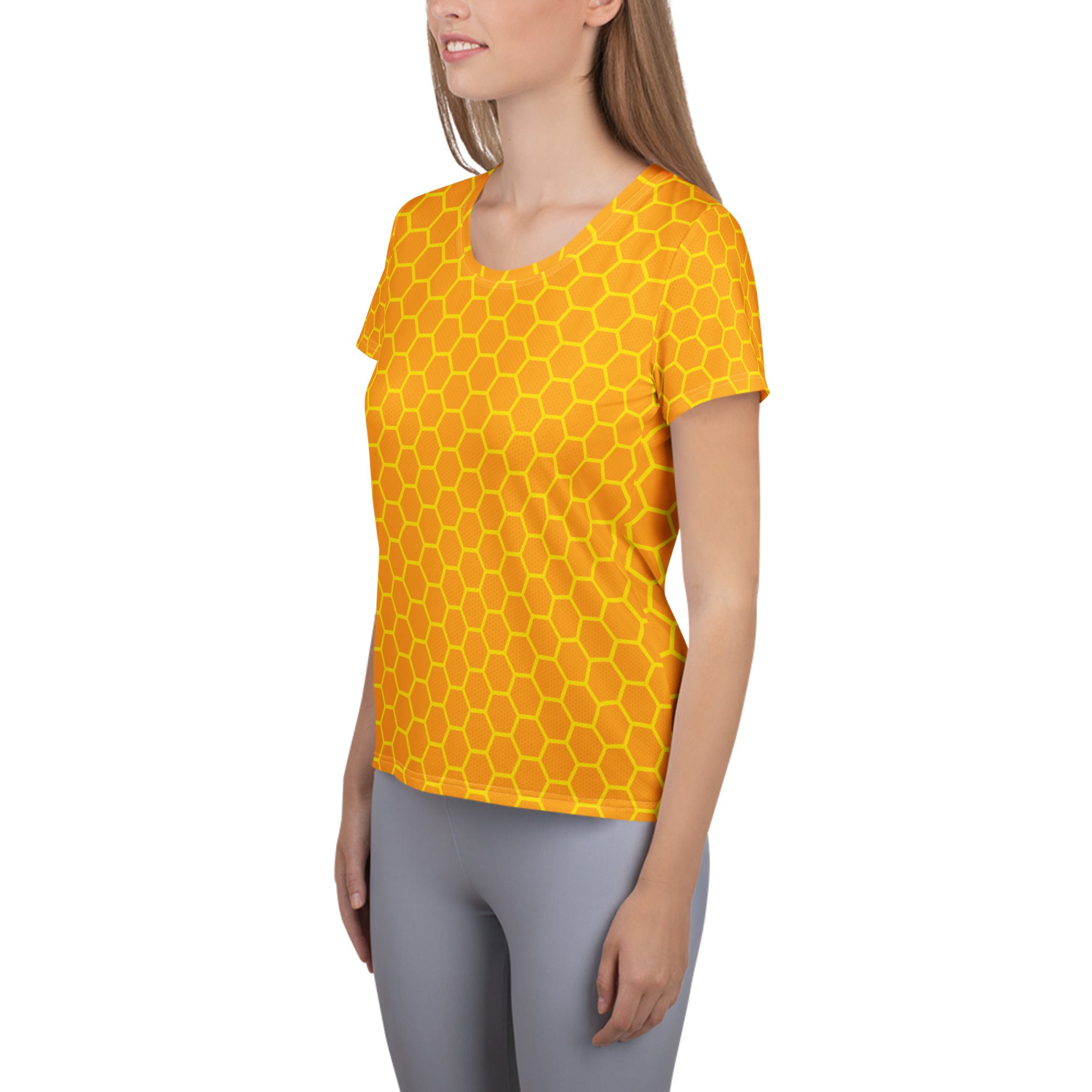A vibrant yellow women’s honeycomb performance athletic t-shirt with bold pattern lightweight moisture wicking