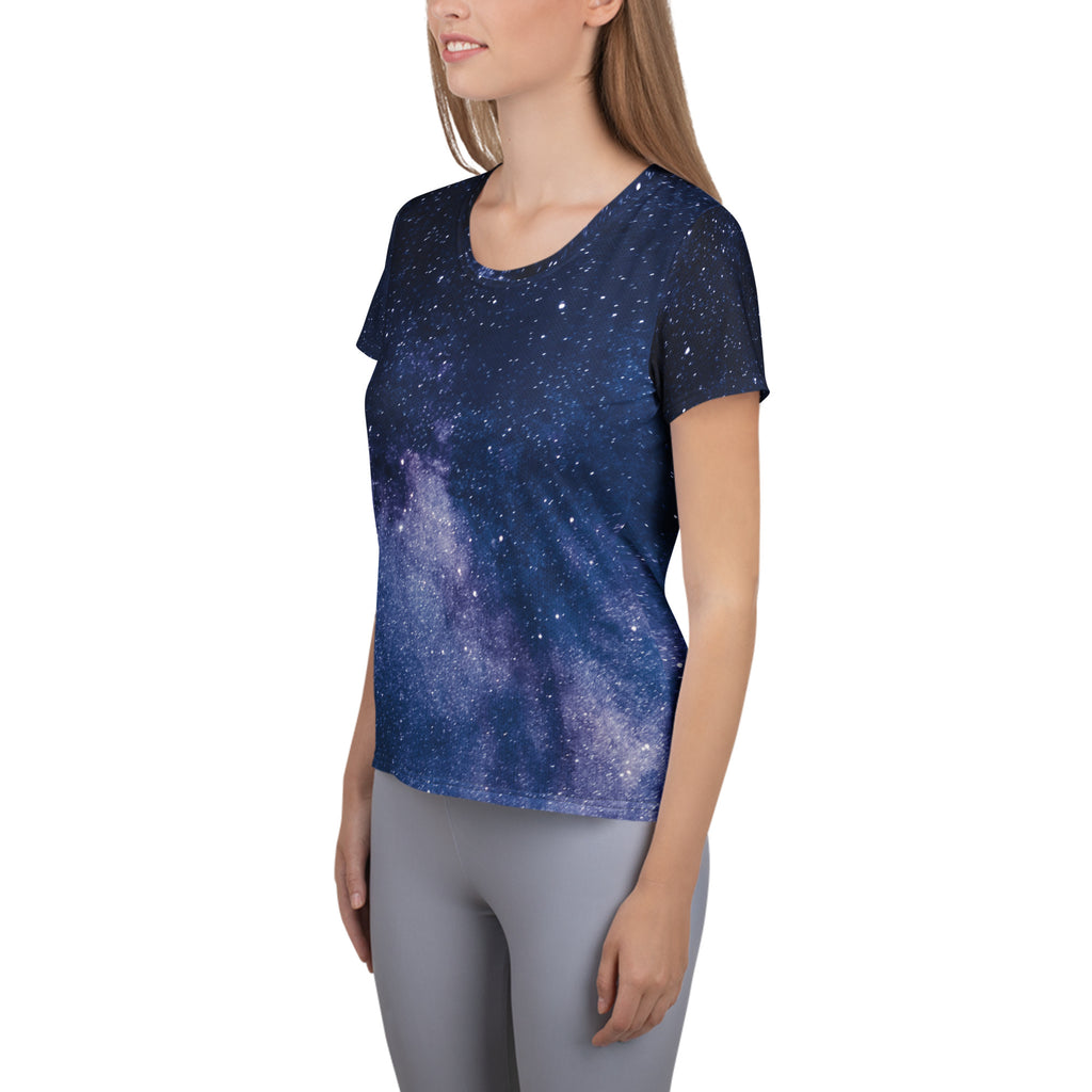 A navy blue women’s short-sleeved athletic t-shirt with a realistic galaxy print and moisture wicking fabric for workouts