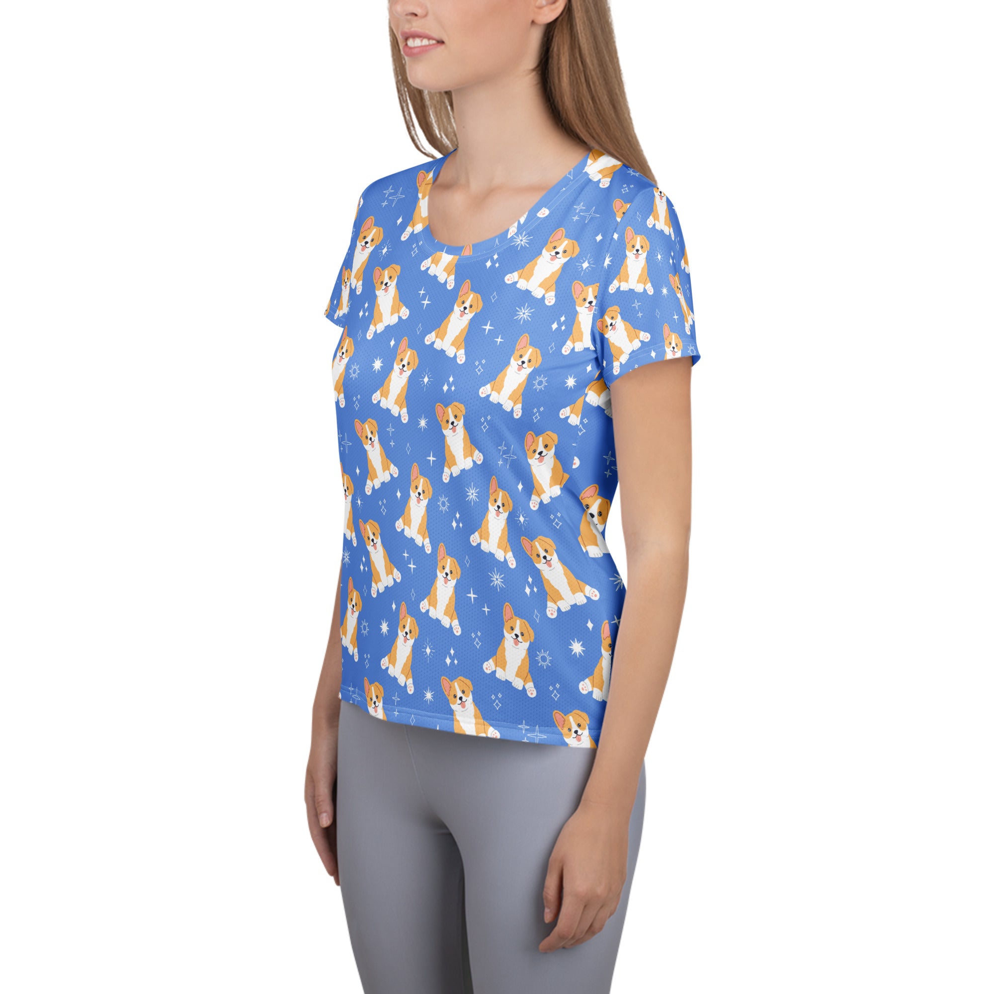 Women’s blue short-sleeved performance athletic t-shirt with cartoon corgis and sparkles, lightweight and moisture wicking