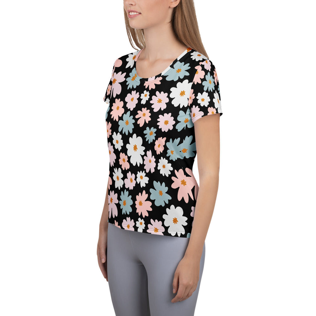 Black short-sleeved lightweight moisture wicking athletic t-shirt with vibrant pink white and blue daisy floral pattern and UPF 50+