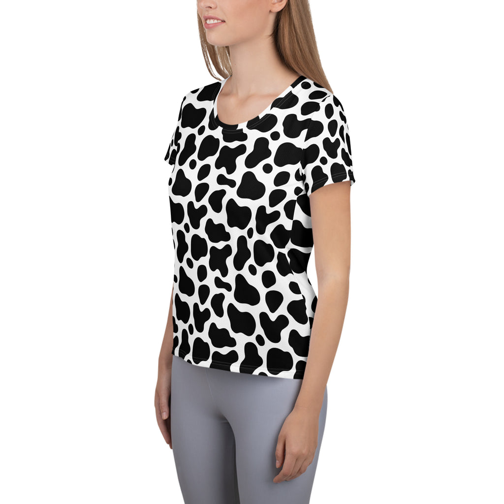 Women’s black and white cow print short-sleeved performance athletic t-shirt with moisture wicking and upf 50+ protection