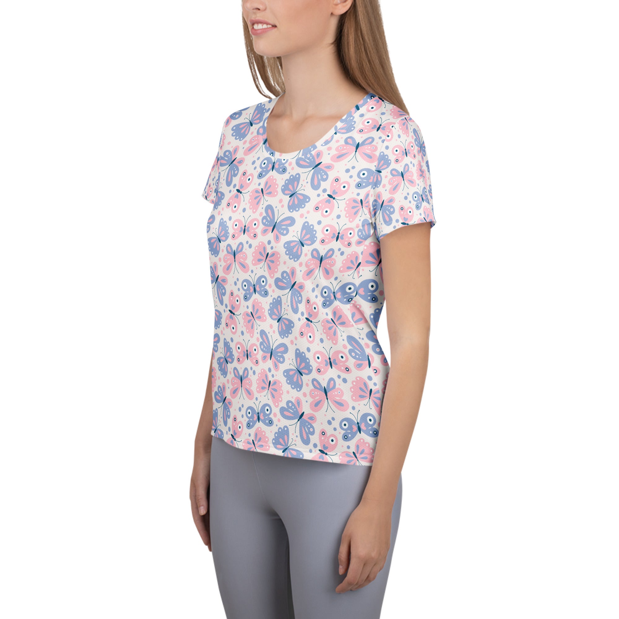 Women’s pastel butterfly print performance athletic t-shirt with pink and blue cartoon butterflies on white background