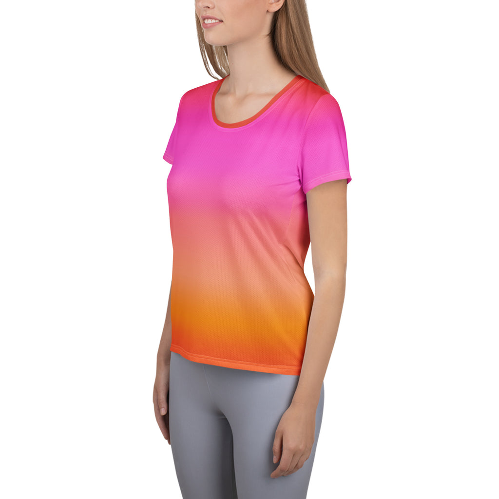 Women’s sunset ombre performance athletic t-shirt with bright pink to orange gradient and moisture wicking fabric